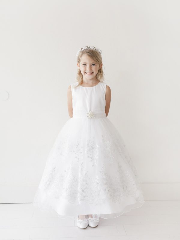 5716 — 5716 Ivory Communion Dresses Satin Waist With Ruched Waist and Removable Brooch. Skirt Has Lace Applique With Fish Line Hem