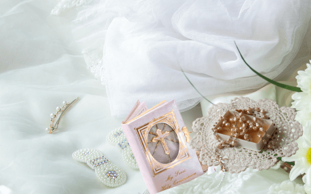 First Communion accessories include Bible, Rosary, or veil.